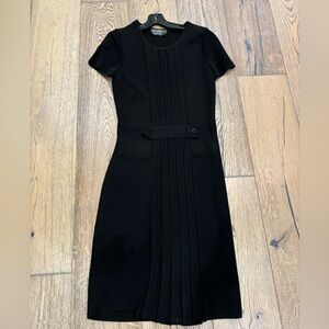 Black Salvatore Ferragamo dress.